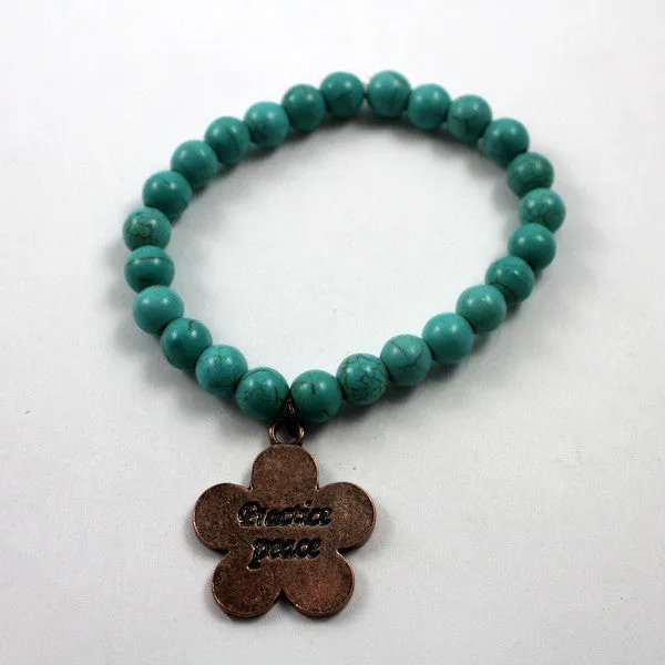 Turquoise beaded bracelet with Copper toned Practice Peace Charm